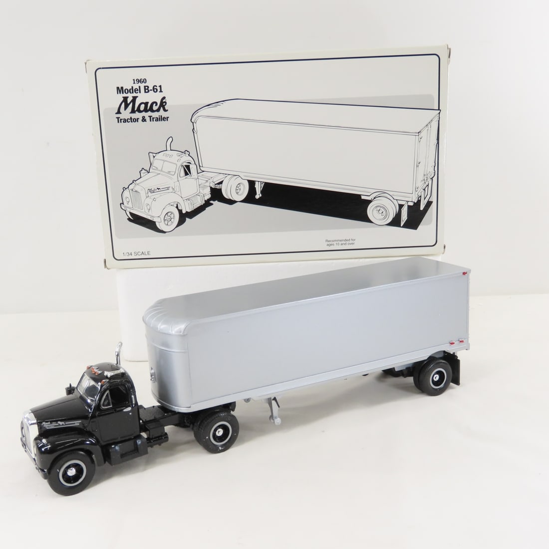 1st Gear 1:34 Black Cab Mack B-61 Tractor Trailer: 1st Gear 1:34 Black Cab Mack B-61 Tractor Trailer - Diecast Metal Black Cab, Blank Trailer. Has original shipping box. LOT SIZE 13x8x4" 2 LBS All information and photos, which are part of the descript
