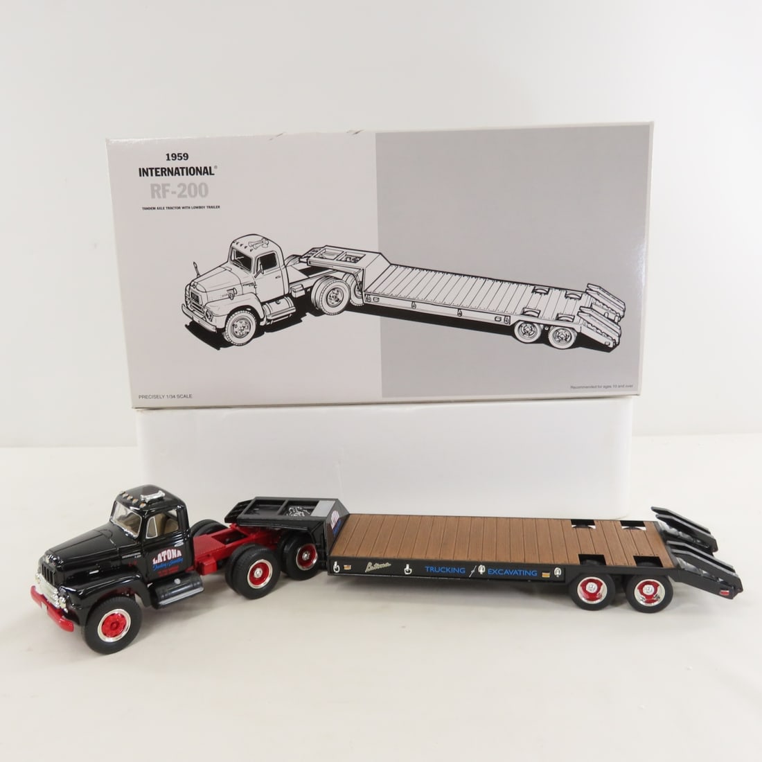 1st Gear Latona 1959 INTL RF200 Tractor Trailer: 1st Gear Latona 1959 INTL RF200 Tractor Trailer - 1:34 Diecast Metal 18-2118 Latona Trucking Tandem Axle Lowboy Trailer. LOT SIZE: 15x8x4" 3 LBS All information and photos, which are part of the