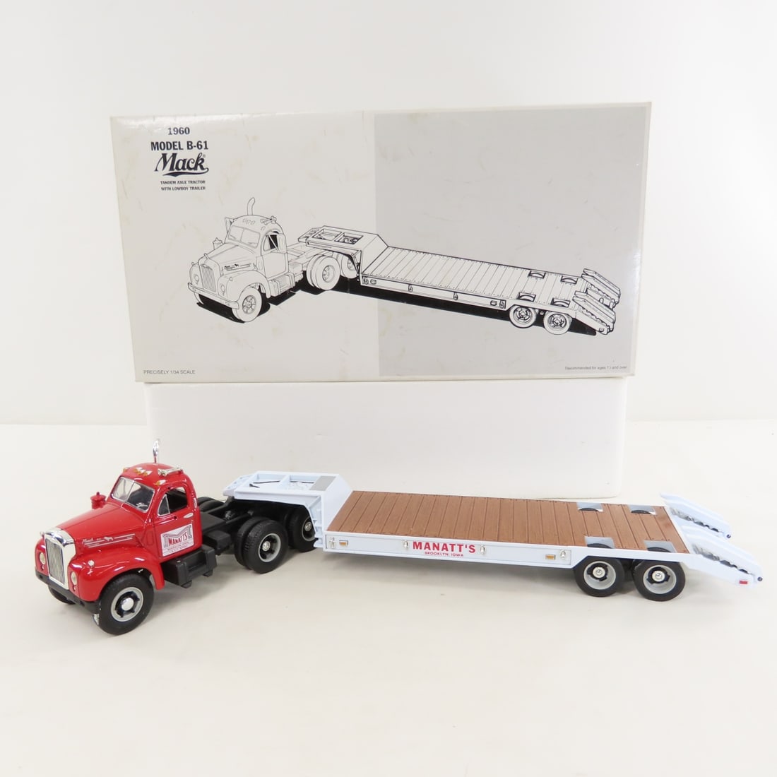 1st Gear 1:34 Manatt's 1960 Mack B61 Cab &Trailer: 1st Gear 1:34 Manatt's 1960 Mack B61 Cab &Trailer - Diecast Metal 19-2167 Tandem Axle Tractor with Lowboy Trailer. LOT SIZE: 15x8x4" 2 LBS All information and photos, which are part of the