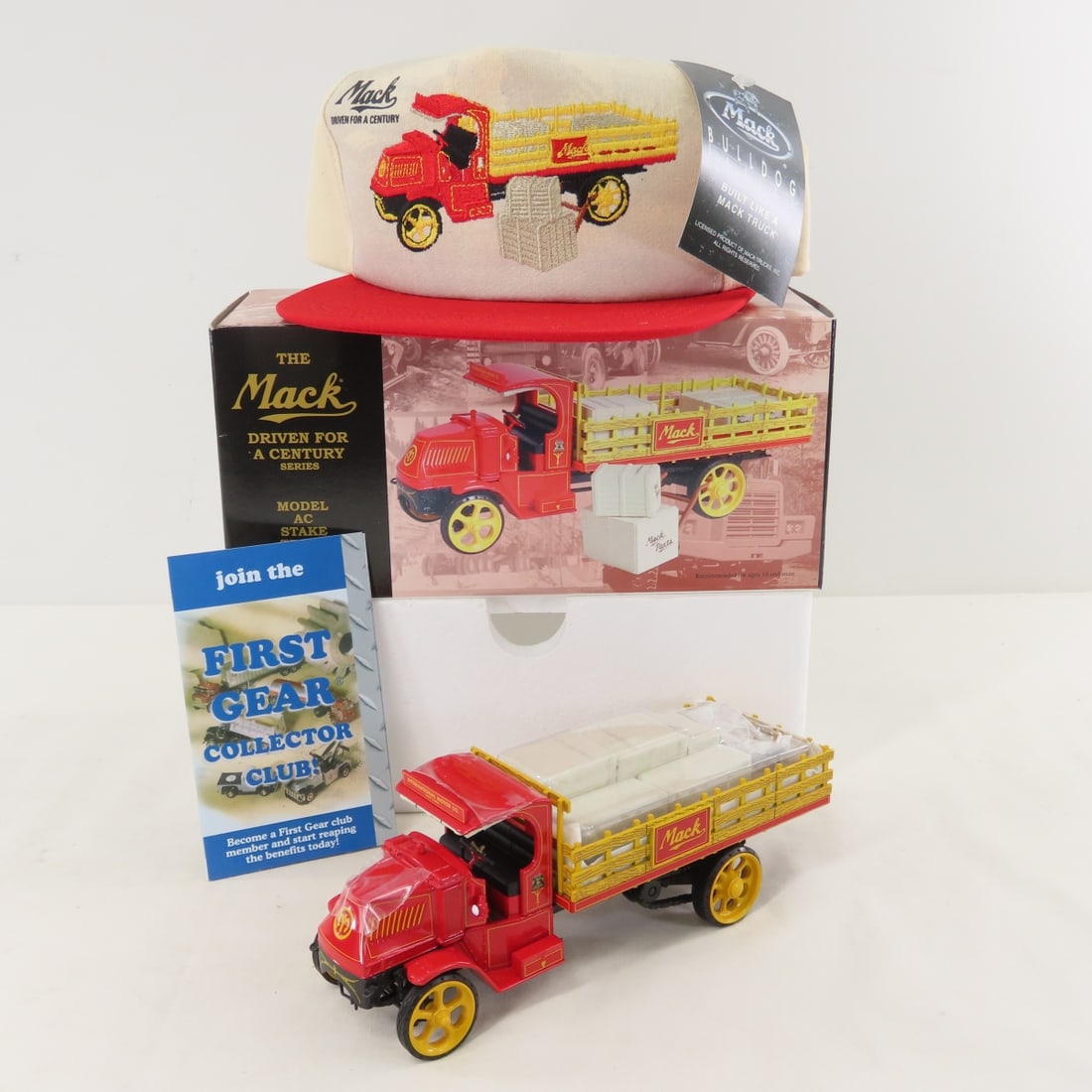 1st Gear 1:34 Mack AC Stake Truck, Embroidered Hat: 1st Gear 1:34 Mack AC Stake Truck, Embroidered Hat - Diecast Metal 19-2522. With original shipping box. LOT SIZE: 10x9x5" 2 LBS All information and photos, which are part of the description, are