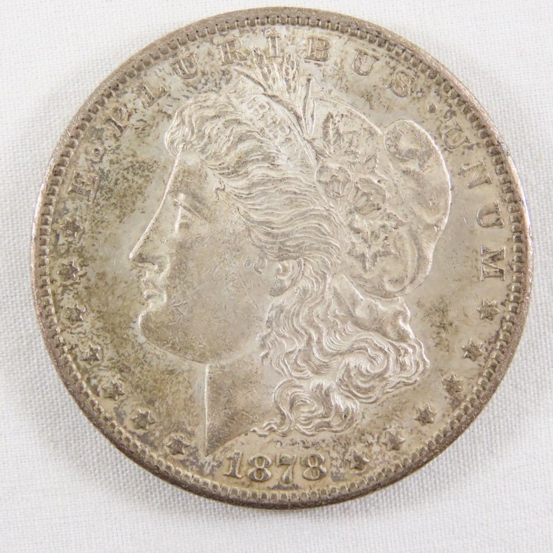 1878 S Morgan Silver Dollar: 1878 S Morgan Silver Dollar - LOT SIZE: 2x2x1" 1 LB All information and photos, which are part of the description, are intended to be as accurate as possible, but errors are possible. No item may be
