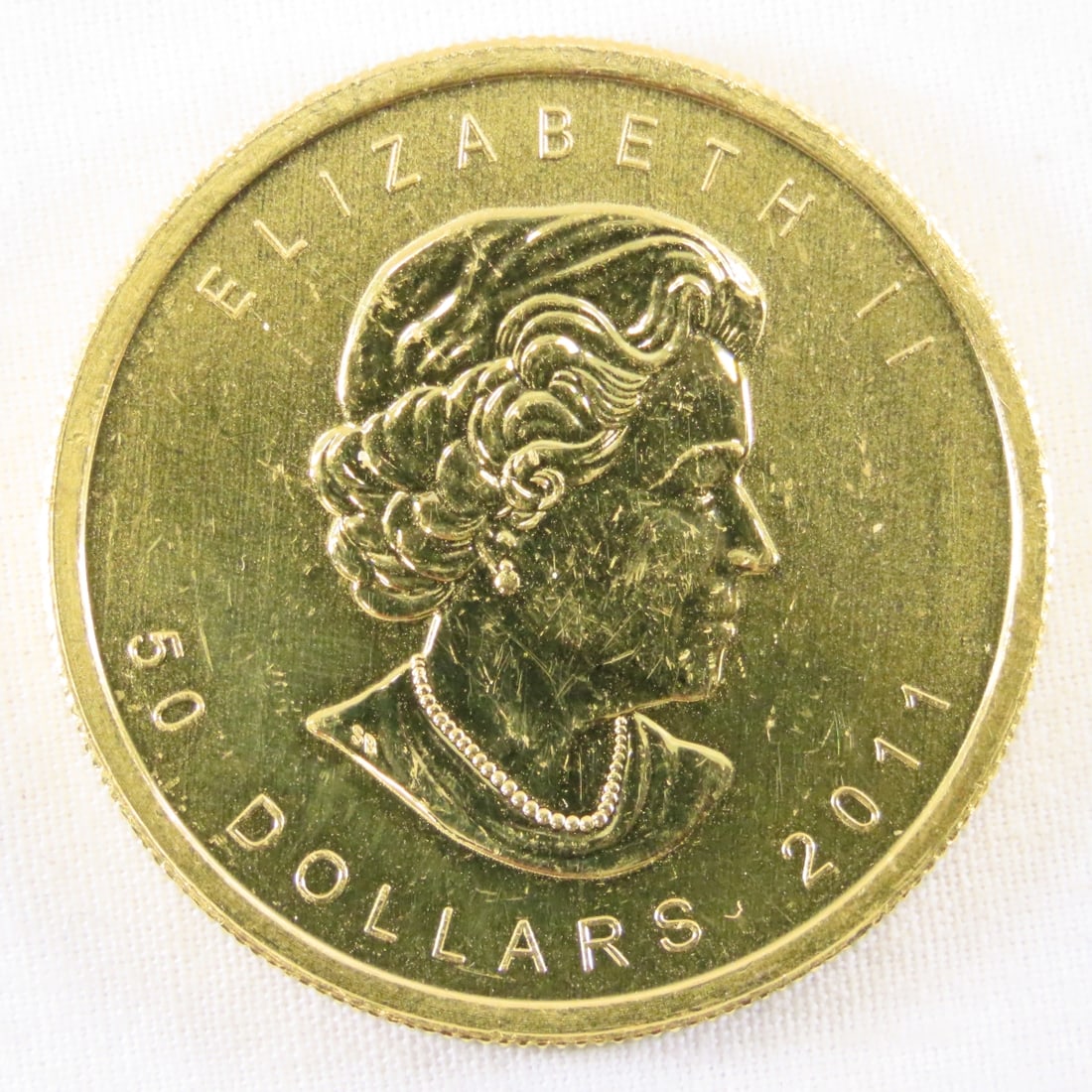 2011 Canadian $50 Gold 1 ozt .999 Fine Gold: 2011 Canadian $50 Gold 1 ozt .999 Fine Gold - LOT SIZE: 2x2x1" 1 LB All information and photos, which are part of the description, are intended to be as accurate as possible, but errors are possible.