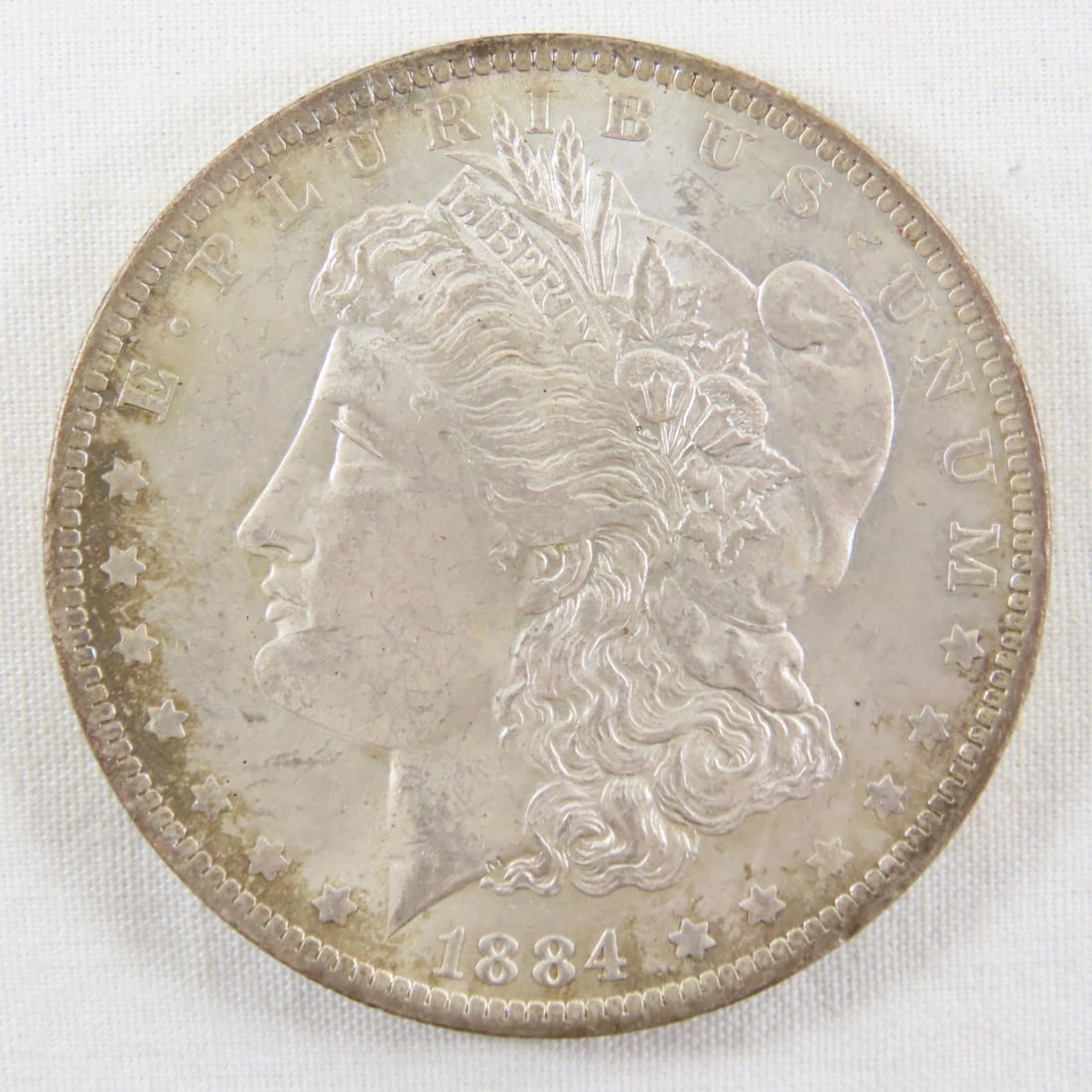 1884 O Morgan Silver Dollar: 1884 O Morgan Silver Dollar - LOT SIZE: 2x2x1" 1 LB All information and photos, which are part of the description, are intended to be as accurate as possible, but errors are possible. No item may be