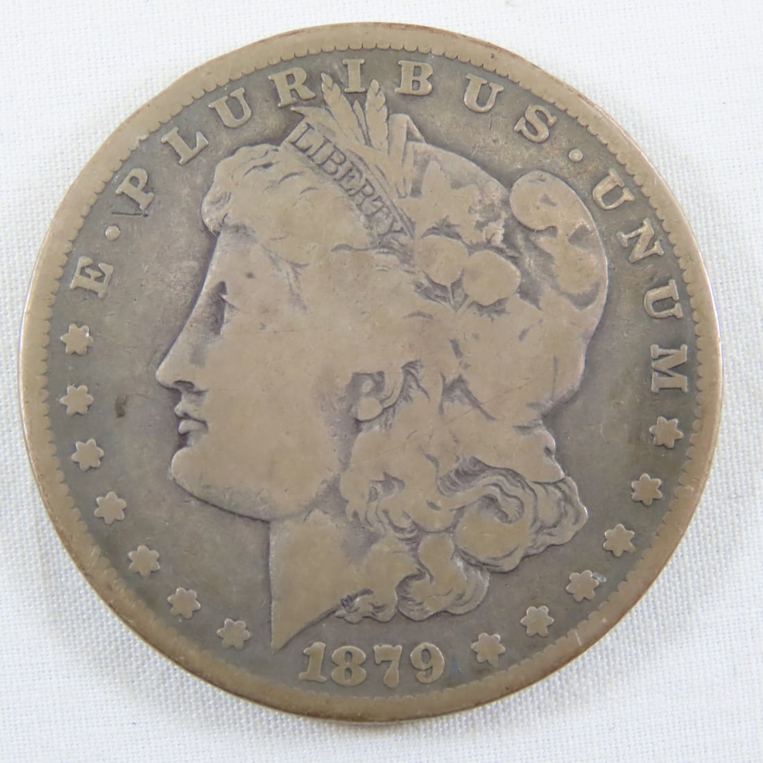 1879 S Morgan Silver Dollar: 1879 S Morgan Silver Dollar - LOT SIZE: 2x2x1" 1 LB All information and photos, which are part of the description, are intended to be as accurate as possible, but errors are possible. No item may be