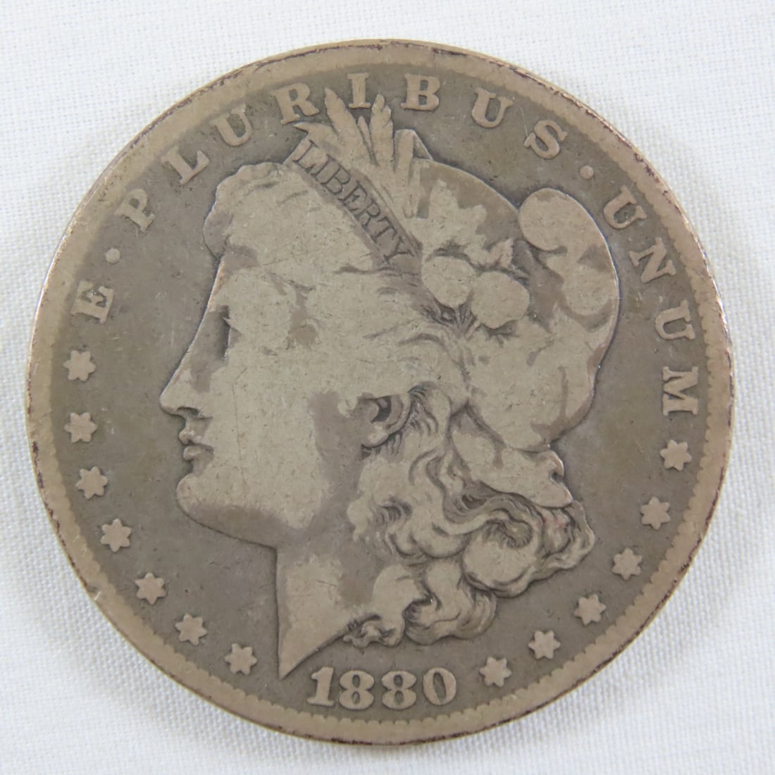 1880 O Morgan Silver Dollar: 1880 O Morgan Silver Dollar - LOT SIZE: 2x2x1" 1 LB All information and photos, which are part of the description, are intended to be as accurate as possible, but errors are possible. No item may be
