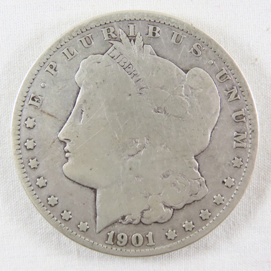 1901 O Morgan Silver Dollar: 1901 O Morgan Silver Dollar - LOT SIZE: 2x2x1" 1 LB All information and photos, which are part of the description, are intended to be as accurate as possible, but errors are possible. No item may be r