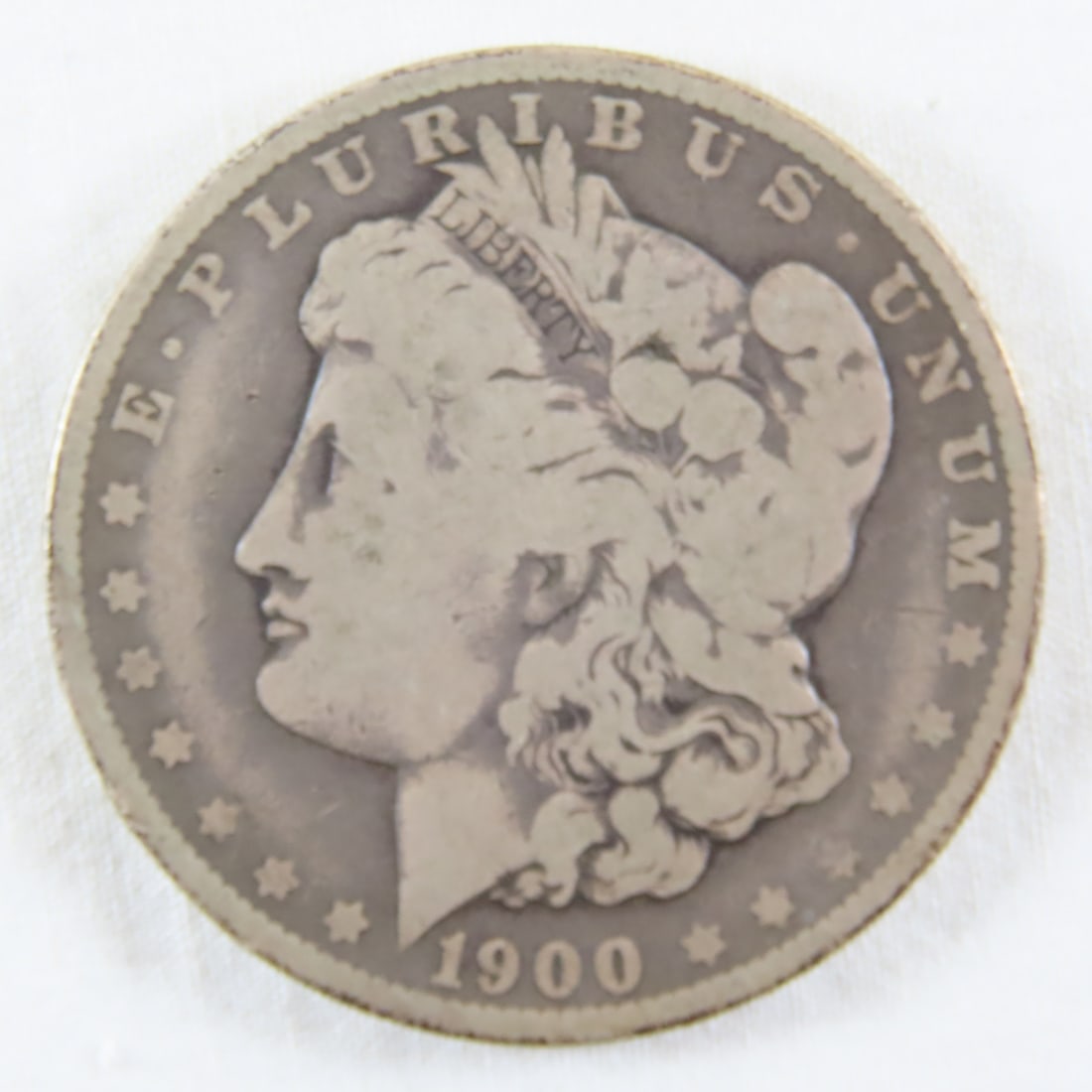 1900 O Morgan Silver Dollar: 1900 O Morgan Silver Dollar - LOT SIZE: 2x2x1" 1 LB All information and photos, which are part of the description, are intended to be as accurate as possible, but errors are possible. No item may be