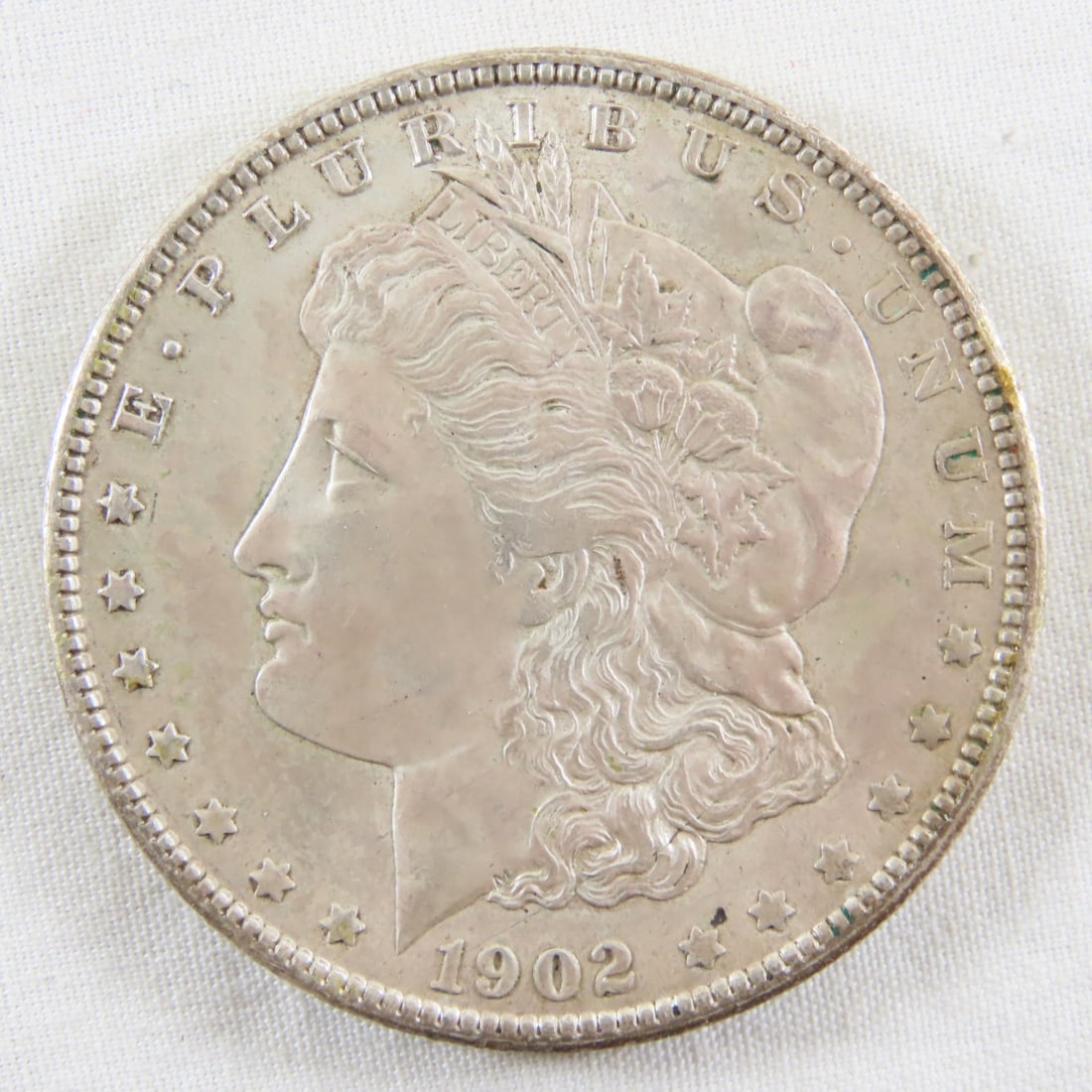 1902 O Morgan Silver Dollar: 1902 O Morgan Silver Dollar - LOT SIZE: 2x2x1" 1 LB All information and photos, which are part of the description, are intended to be as accurate as possible, but errors are possible. No item may be