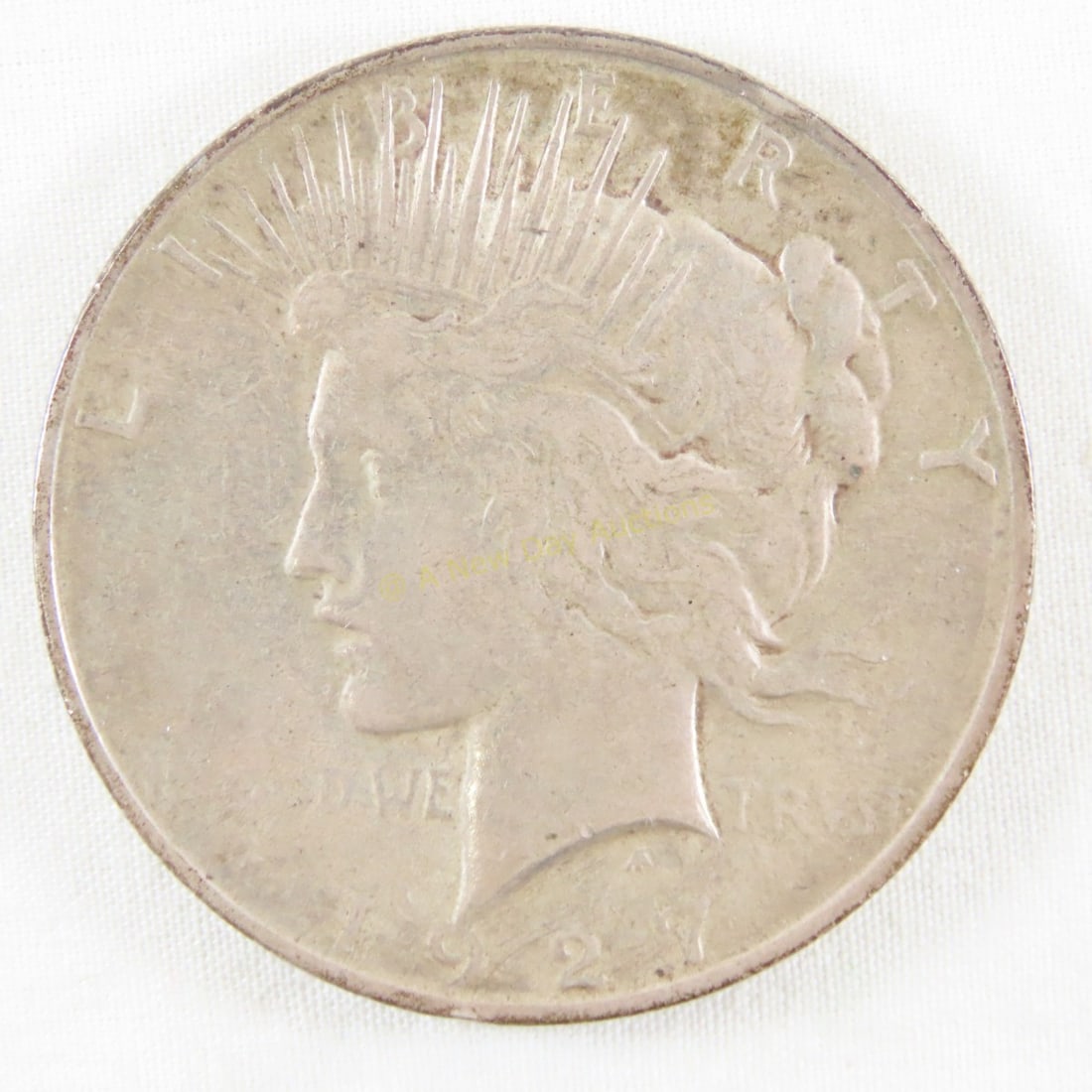 1927 D Peace Silver Dollar: 1927 D Peace Silver Dollar - LOT SIZE: 2x2x1" 1 LB All information and photos, which are part of the description, are intended to be as accurate as possible, but errors are possible. No item may be re