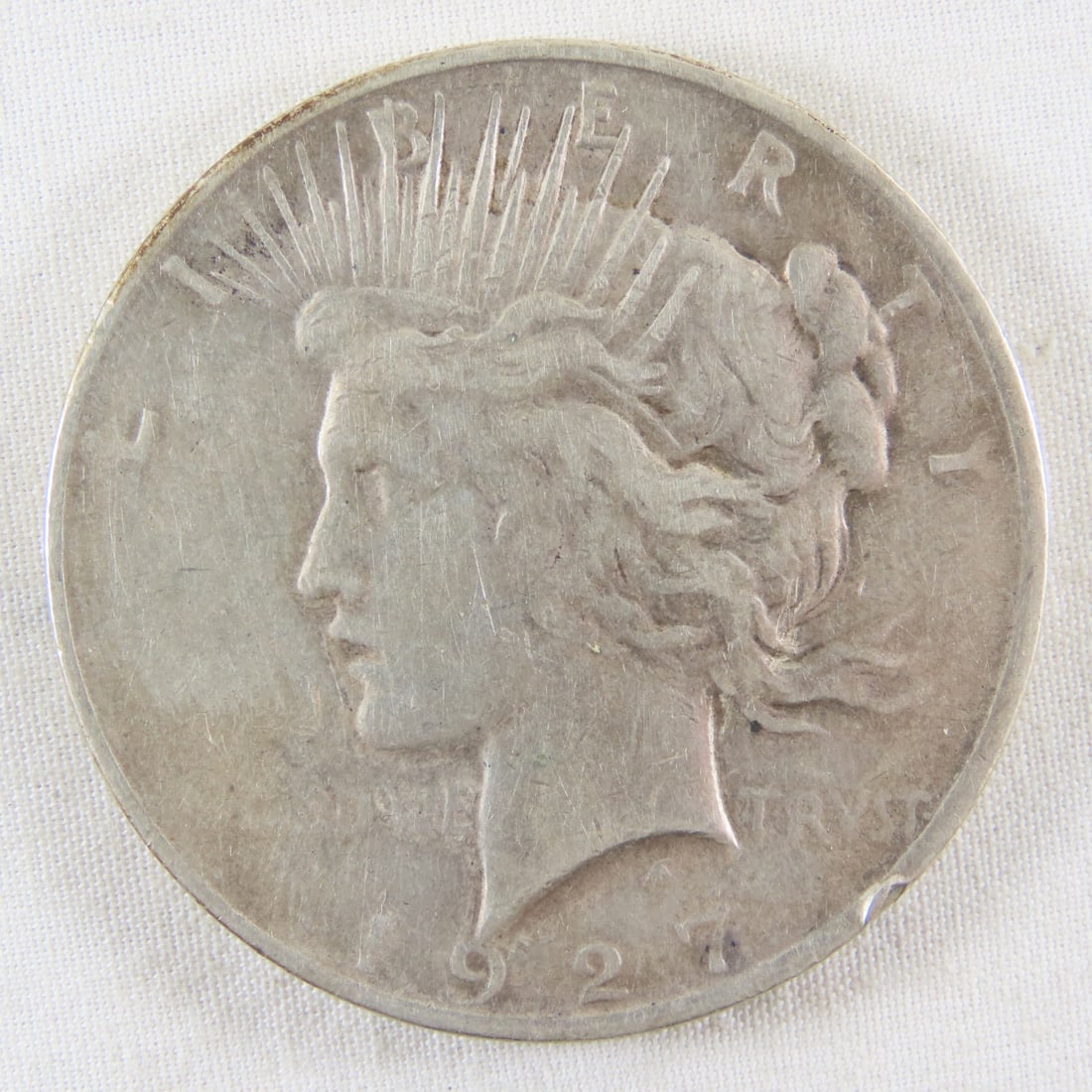 1927 D Peace Silver Dollar: 1927 D Peace Silver Dollar - LOT SIZE: 2x2x1" 1 LB All information and photos, which are part of the description, are intended to be as accurate as possible, but errors are possible. No item may be re