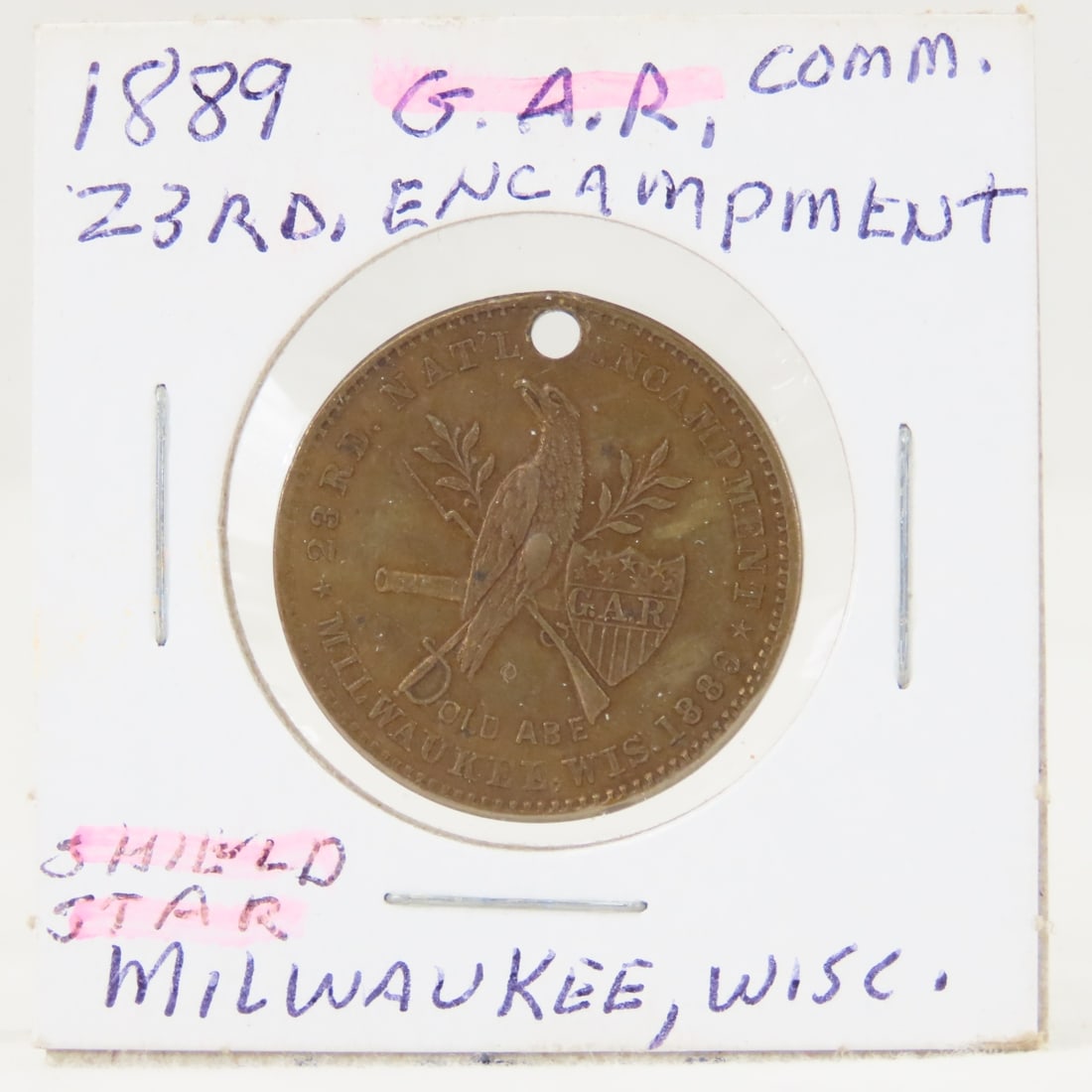 1889 Commemorative Token 23rd. Encampment G.A.R.: 1889 Commemorative Token 23rd. Encampment G.A.R. - Milwaukee, Wisc Shield/Star holed. LOT SIZE: 2x2x1" 1 LB All information and photos, which are part of the description, are intended to be as