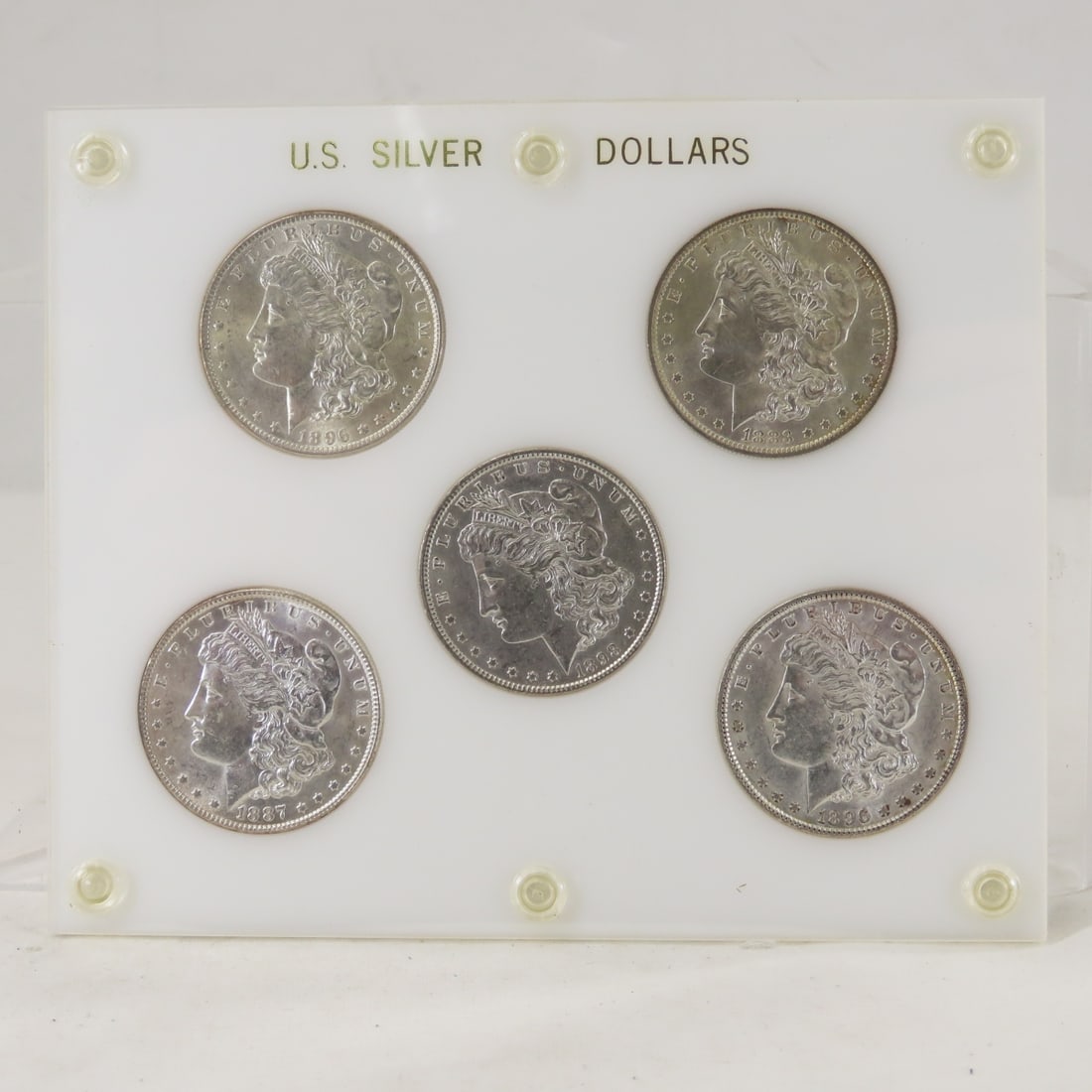 5 Morgan Silver Dollars in case 1883-1898 XF-AU: 5 Morgan Silver Dollars in case 1883-1898 XF-AU - 1883 O, 1887, 1896x2, 1898, all look XF-AU. LOT SIZE: 6x5x1" 1 LB All information and photos, which are part of the description, are intended to be