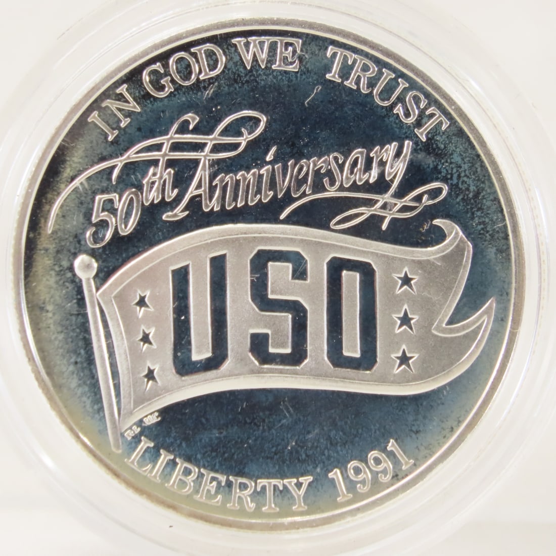 1991 S 50th Anniversary USO Proof Silver Dollar: 1991 S 50th Anniversary USO Proof Silver Dollar - LOT SIZE: 2x2x1" 1 LB All information and photos, which are part of the description, are intended to be as accurate as possible, but errors are possib