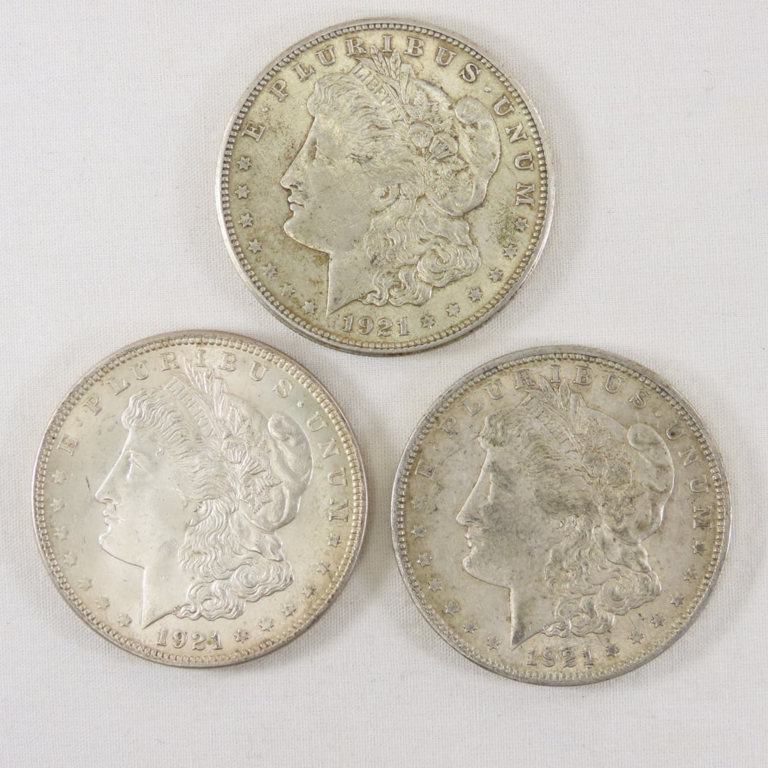 1921 P,D,S Morgan Silver Dollars: 1921 P,D,S Morgan Silver Dollars - LOT SIZE: 2x2x1" 1 LB All information and photos, which are part of the description, are intended to be as accurate as possible, but errors are possible. No item may
