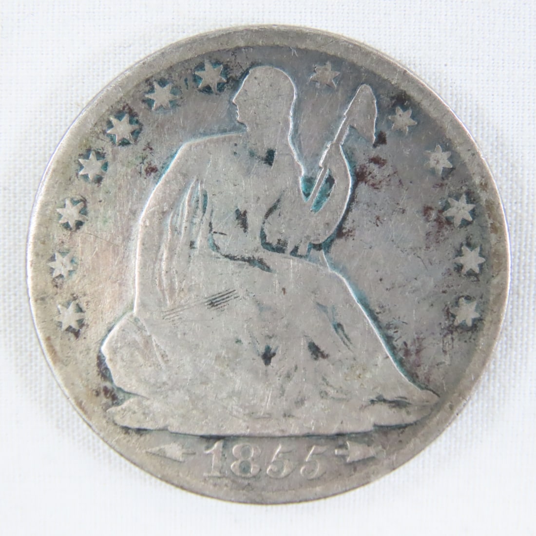 1855 O Seated Liberty Silver Half Dollar: 1855 O Seated Liberty Silver Half Dollar - With Arrows. LOT SIZE: 2x2x1" 1 LB All information and photos, which are part of the description, are intended to be as accurate as possible, but errors are