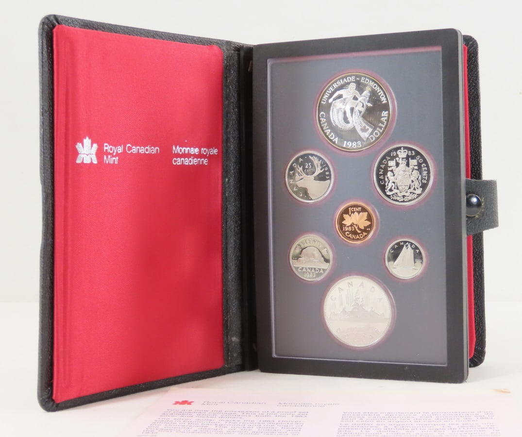 1983 Royal Canadian Mint Double Dollar Proof Set: 1983 Royal Canadian Mint Double Dollar Proof Set - With box and paperwork. 1 Silver Dollar is 50% Silver. LOT SIZE: 7x5x2" 1 LB All information and photos, which are part of the description, are inten