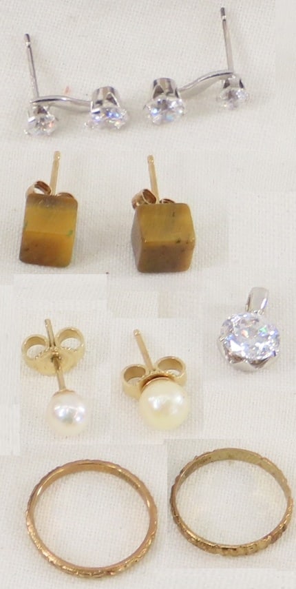 10kt Baby Rings, Earrings & 14kt Mounted Jewelry: 10kt Baby Rings, Earrings & 14kt Mounted Jewelry - 2 10 kt yellow gold baby rings-.8 grams, 1 pair white gold earrings with not diamonds .6 grams, 1 14 kt white gold mounted CZ pendant .9 grams,