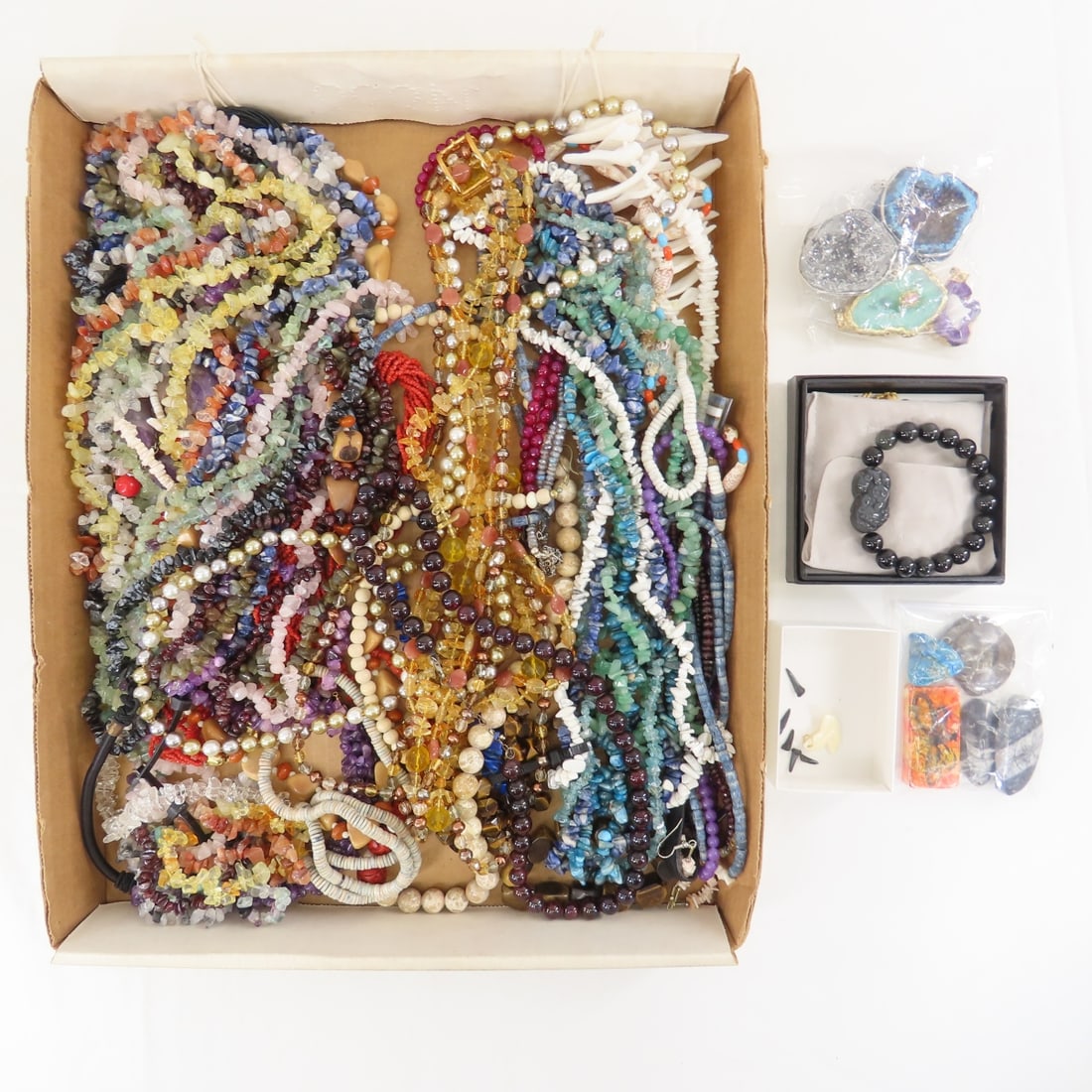 Quartz, Stone, Geode and Other Jewelry: Quartz, Stone, Geode and Other Jewelry - polished stone bead necklaces, some shell, Buddha power bracelets, several loose sharks teeth. LOT SIZE: 12x10x10" 7 LBS All information and photos, which are