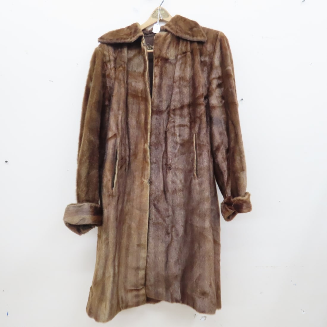 Albrecht Fur 1855 Mink Coat with Pockets: Albrecht Fur 1855 Mink Coat with Pockets - some wear and small separation at left arm pit, some repairs at hooks and eyes. 42" from collar to hem on back, 20" inside from armpit to armpit, 17"