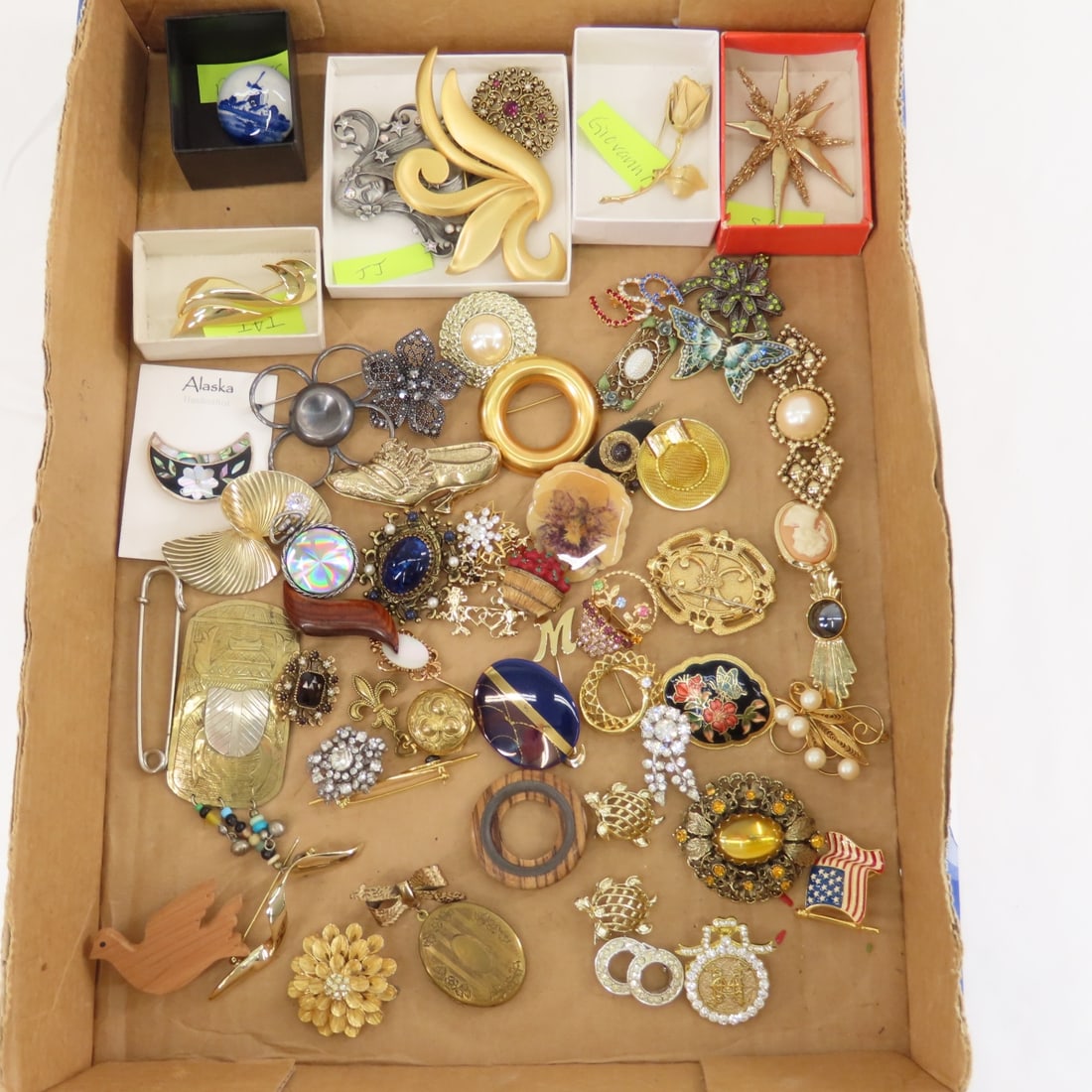 JJ, Giovanni, TAT, SA, Delfts & Vintage Brooches: JJ, Giovanni, TAT, SA, Delfts & Vintage Brooches - Alaska inlay, rhinestone, porcelain, wood, metal, locket and more. LOT SIZE: 10x10x10" 2 LBS All information and photos, which are part of the