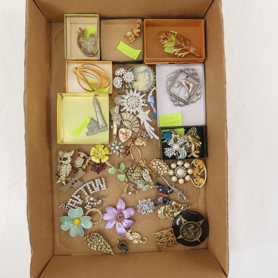 Paradise, Emmons and Other Vintage Brooches: Paradise, Emmons and Other Vintage Brooches - Denmark silverplate, MYLU, Spoon pewter lighthouse brooch, Spain , Gerry's and others. 2 AFTON rhinestone brooches. LOT SIZE: 10x8x8" 2 LBS All