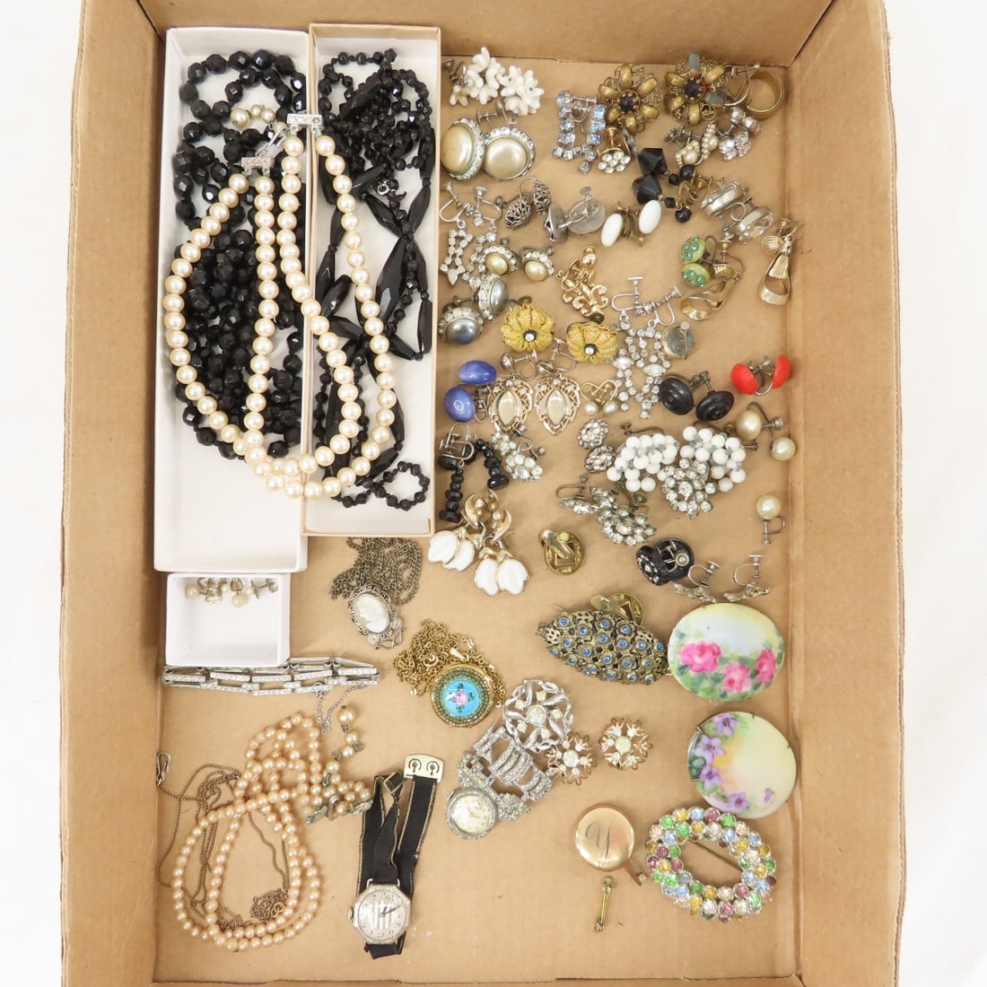 Antique Glass Necklaces, Earrings & More: Antique Glass Necklaces, Earrings & More - 2 black glass faceted bead necklaces, many paired clip or screw back earrings, faux pearls, necklaces, ship brooch with watch (not working), other watch not