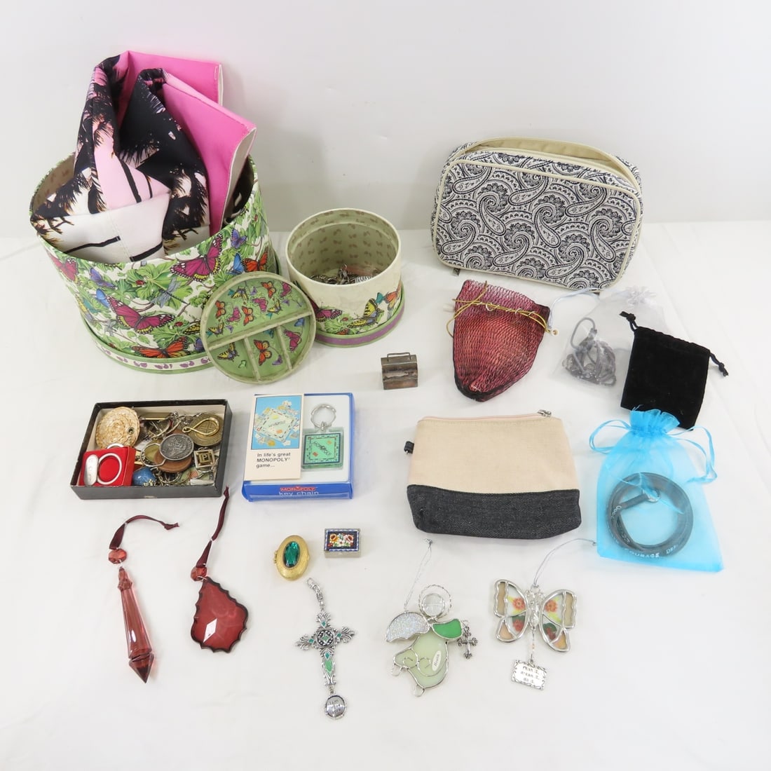 Key Chains, Bag Charms, Jewelry Storage & More: Key Chains, Bag Charms, Jewelry Storage & More - 1 zipper bag with some earrings, 2 cardboard butterfly boxes. LOT SIZE: 12x12x12" 6 LBS All information and photos, which are part of the description, 