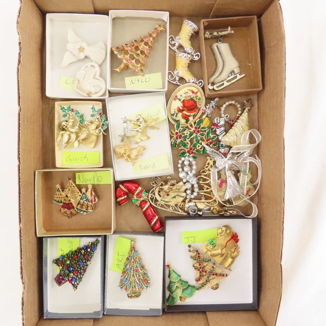 30 + Christmas Brooches Including 13 signed: 30 + Christmas Brooches Including 13 signed - 3 JJ, Art, Sweet Romance, New Pro, 2 Giusti, David, Gigi, NYLU, 2 Lenox and 1 plastic Ice Capades pin. LOT SIZE 5x5x5" 1 LB All information and photos, wh