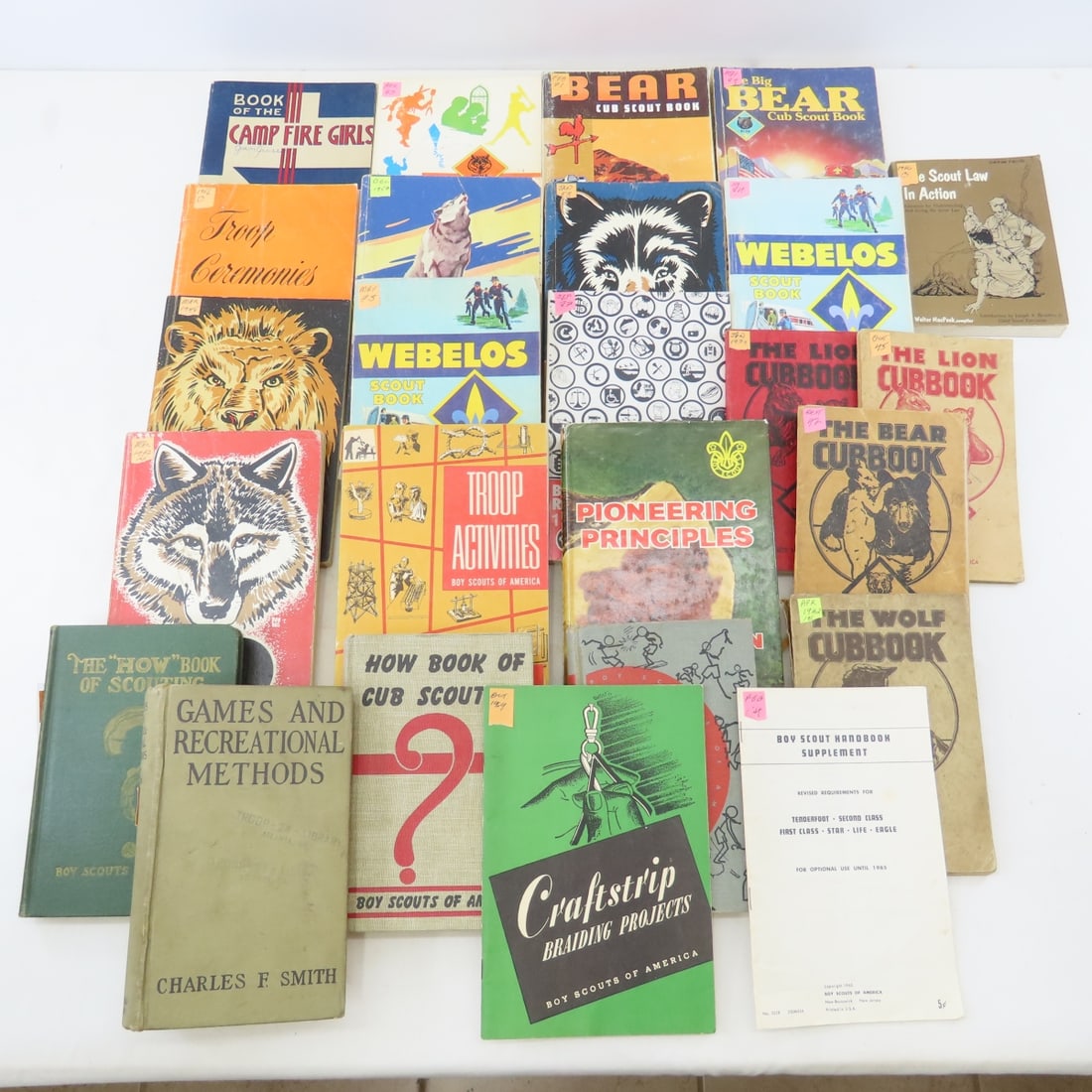 Vintage Cub Scouts Manuals, How-To Books & More: Vintage Cub Scouts Manuals, How-To Books & More - Webelos, Camp Fire Girls, Wolf & Bear, Lion Cub book, Pioneering Principles, Troop Activities, How-To book of Scouting & Others. LOT SIZE: 11x9x8" 14