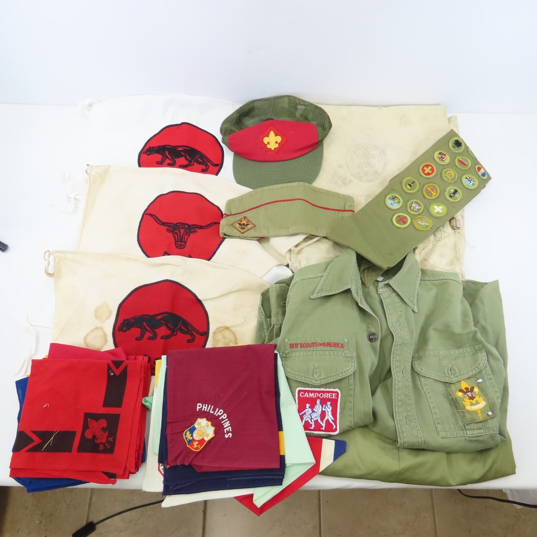 Vintage Boy Scouts Patrol Flags, Neckerchiefs: Vintage Boy Scouts Patrol Flags, Neckerchiefs - Canvas Backpack(soiled/stained), Shirt, Pants, 2 Hats, Sash with Patches, Neckerchiefs. LOT SIZE: 15x12x8" 5 LBS All information and photos, which are
