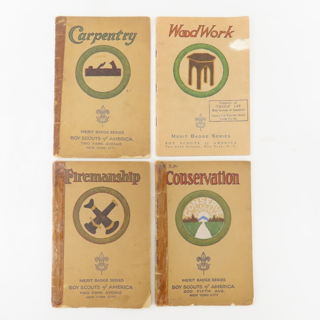 4 1920s-1930s Boy Scouts Merit Badge Books: 4 1920s-1930s Boy Scouts Merit Badge Books - Conservation 1927, Firemanship 1928, Carpentry 1928, Wood Work 1939. 3 of the 4 Have Tape on Spine, Library Stamps inside Front Cover, Some Spine Damage.