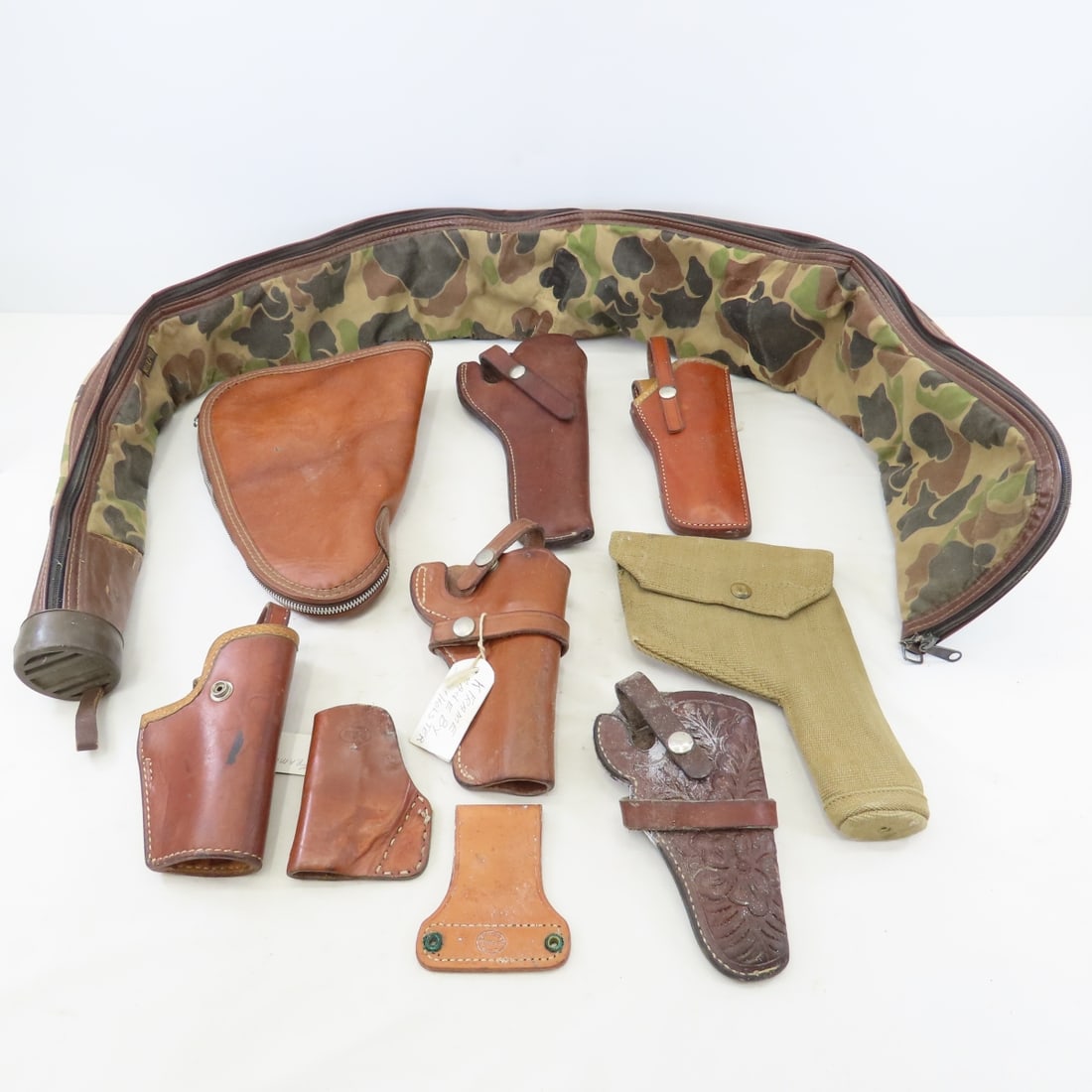 7 Leather Holsters and 2 Gun Bags: 7 Leather Holsters and 2 Gun Bags - zipper rifle bag, zipper pistol bag, canvas pistol belt holster, George Lawrence size 29 leather pistol belt holster, small leather Hunter waist holster, El Paso Sa