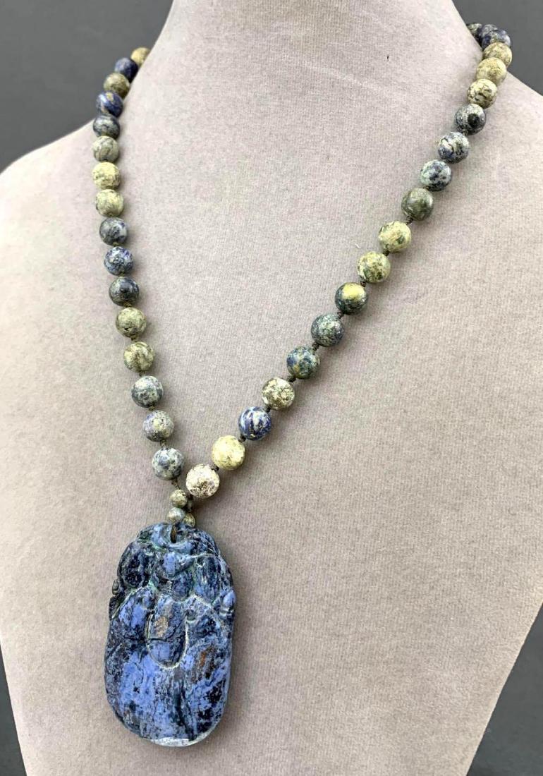 Sodalite Carved Pendant and Bead Necklace: Carved Sodalite bead and pendant necklace. 18.9in open, pendant 2 x 1.25.