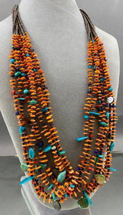 Santo Domingo turquoise, coral, lapis, mother of pearl: Santo Domingo turquoise, coral, lapis, mother of pearl and shell 7 strand heishi necklace with sterling tips and closure . Made by Daniel Coriz, former Governor of Santo Domingo tribe. Length is appr