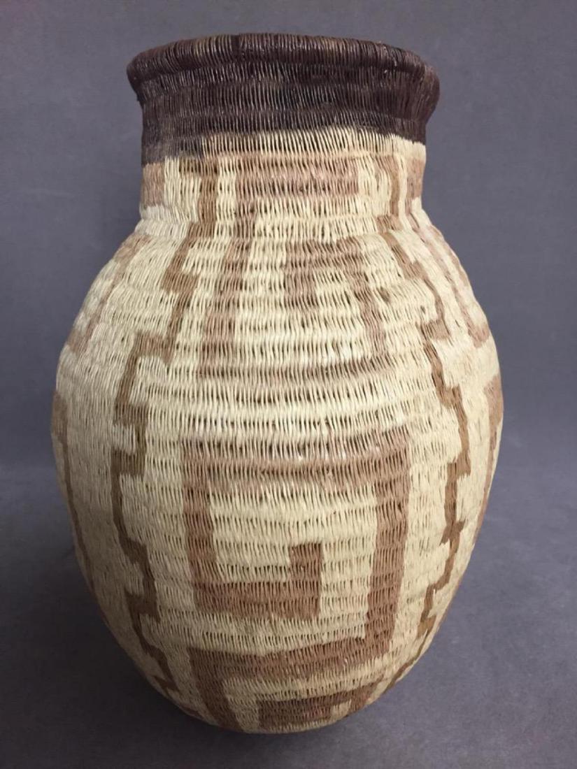 Western Tribes, Native American Woven Basket: Older native tan and brown woven basket in a vase shape. 9 x 7.