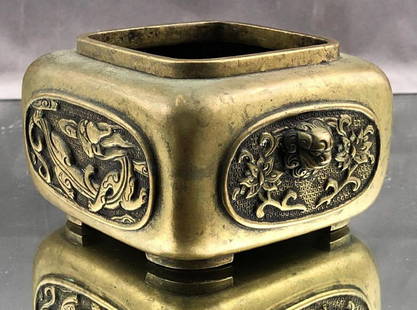 Chinese Bronze Censer with Dragon Motif: Chinese brass Vessel with dragon and lion motif. Approximately 4.25 x 5 x 2.75.