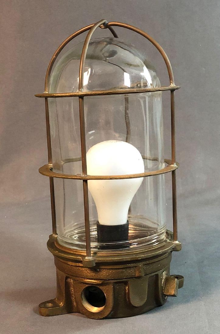 Benjamin Brass Cargo Ship Bulkhead Light: Older Benjamin Brass, cargo ships bulkhead light with cage. Approximately 11 x 6.25 x 5in.
