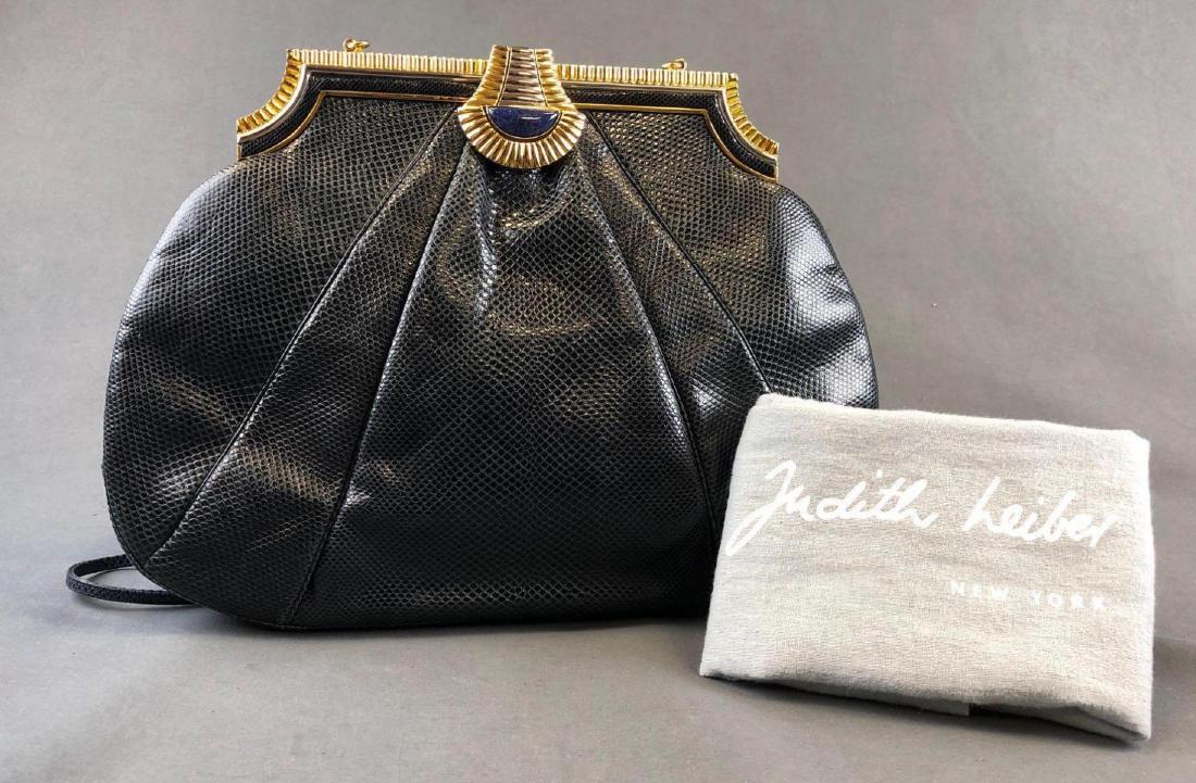 Judith Leiber Snakeskin Bag With Lapis Cabochan Closure: Judith Leiber gathered navy snakeskin and lapis lazuli cabochon shoulder purse. Purse features gold framed foldover metal hardware, thin snakeskin strap and dust bag. Approximately 13 x 10 in and 20in