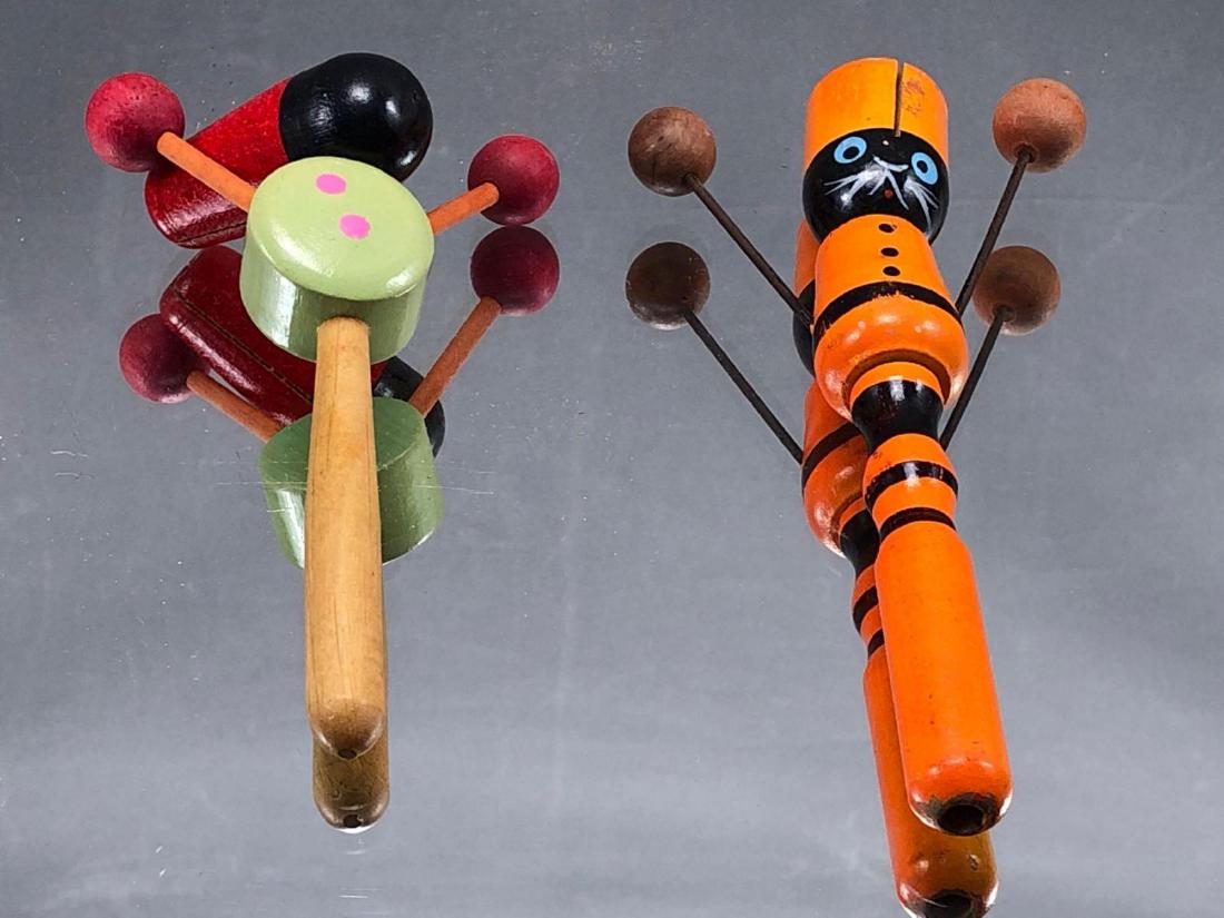 Two Older Wooden Toy Noisemakers: 2 older wood noisemakers, one marked "Japan", orange one measures approximately 1 x 3.5 x 6.75 inches, green one with red hat measures approximately 5.75 x 3.5 x 2.25 inches