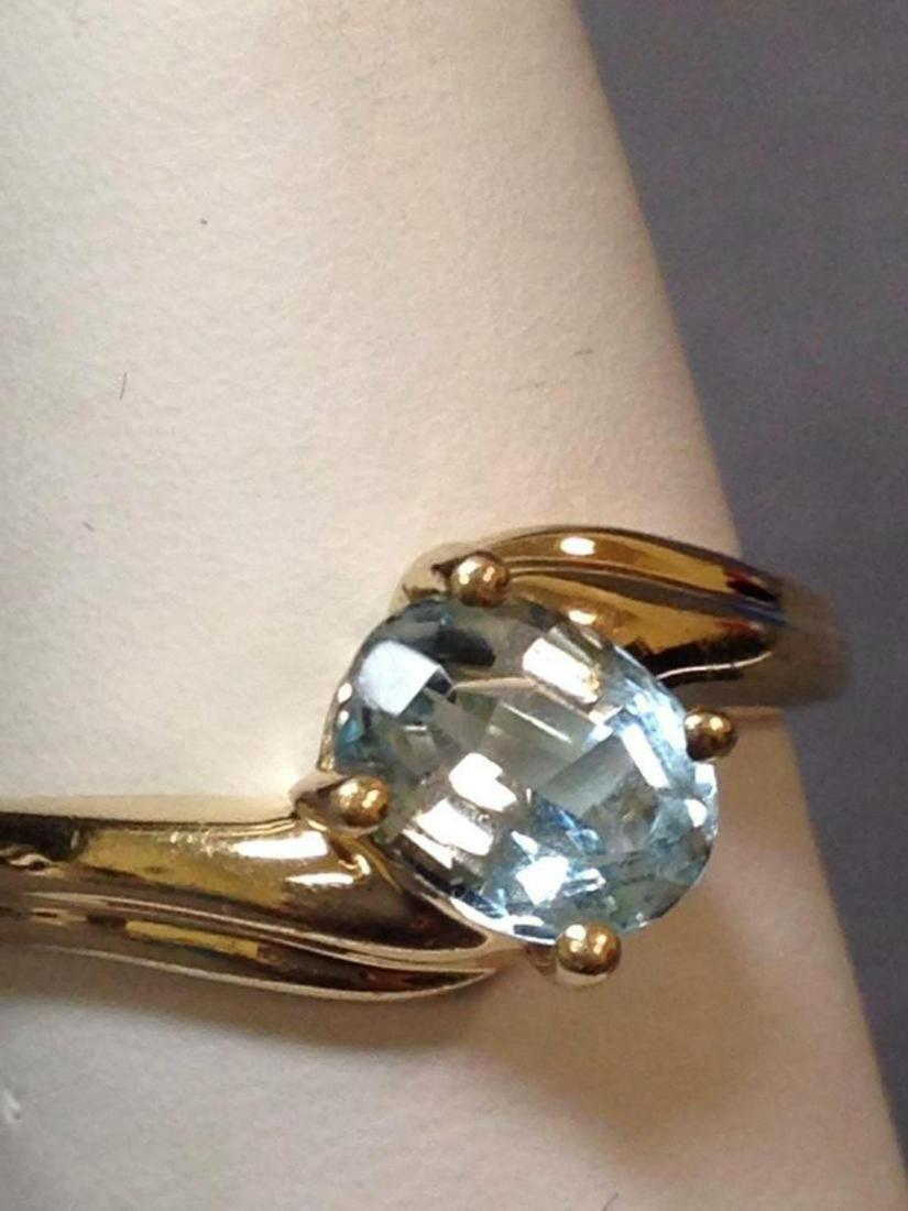 14 karat and faceted blue topaz ring, size 5.5, 2.2 g: 14k and faceted blue topaz ring, size 5.5, 2.2 g All credit card purchases will be manually verified prior to shipping