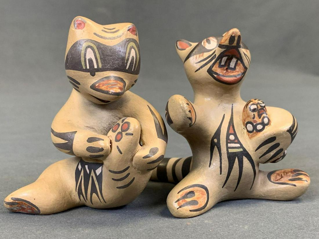 Margaret & Luther Gutierrez Santa Clara Pottery Racoons: 2 Santa Clara pottery raccoons by Martha & Luther Gutierrez. One holding baby approximately 3 x 3 x 3.5in. One holding foot approximately 2.75 x 4 x 3.25in.