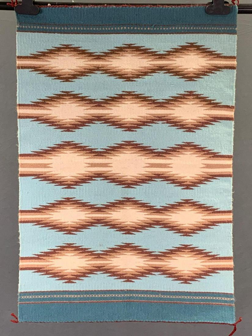 Caroline Dick Navajo Rug Weaving: Navajo Blue brown and white rug we've Blue brown and white rug Woven by Caroline Dick. Approximately 31.5 x 21.5 in.ï¿½Purchased from Crownpoint Rug Weavers Association