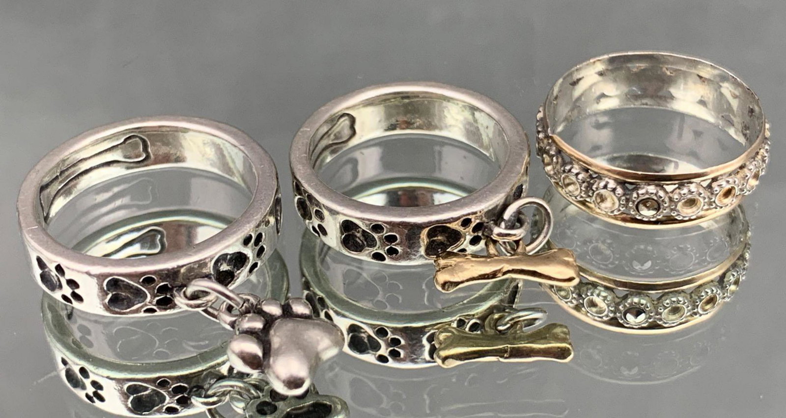 3 14k Gold And Sterling Silver Rings: 14K gold and sterling silver rings lot of 3, 12.7 g., sizes 5, 6, and 7. All Credit Cards Will Be Manually Verified Prior to Shipment.