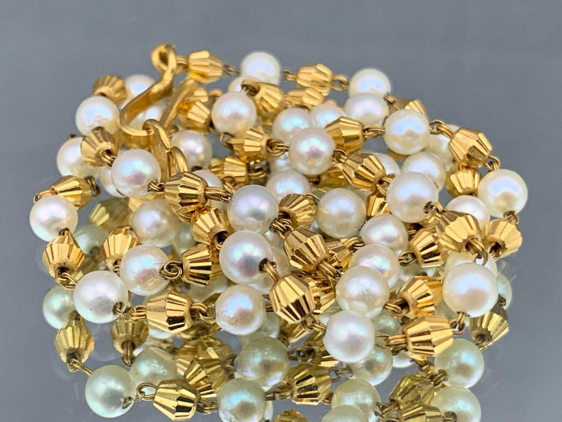 22k Gold And Pearl Necklace. 11.8g: 22kt Gold and Pearl Necklace, 11.8g, marked "22ct" on clasp, length approximately 19.5 inches. ALL CREDIT CARDS WILL MANUALLY VERIFIED PRIOR TO SHIPMENT.