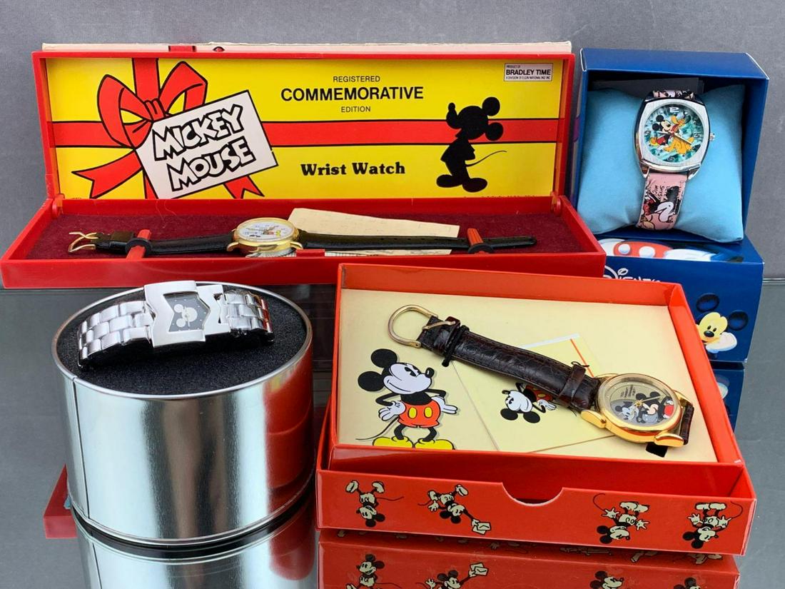 4 Disney Watches, includes 1 Bradley Time Swiss-made: 4 Disney Watches, includes 1 Bradley Time Swiss-made Registered Commemorative Mickey's Birthday Watch, 1 Disney Store Exclusive stainless steel watch with initials MM and silhouette on watch face, 1 C