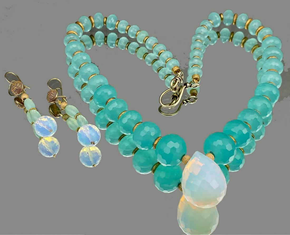 Multi-Faceted Green and Opaline Cut Glass Necklace and: Multi-Faceted Green and Opaline Cut Glass Necklace and Earrings Set, necklace 12 in. closed. Earrings marked 925, 2.5 in. long. All measurements are approximate.