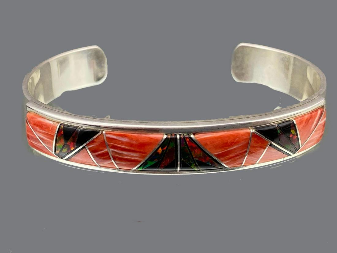 Navajo Sterling Silver Cuff with Inlaid Spiny Oyster: Navajo Sterling Silver Cuff with Inlaid Spiny Oyster and Opal, 29.6g, by Silversmith Kenneth Bitsie, signed, approximately 5.5 in. inside and 1.25 in. at cuff break. ALL CREDIT CARDS WILL BE MANUALLY 