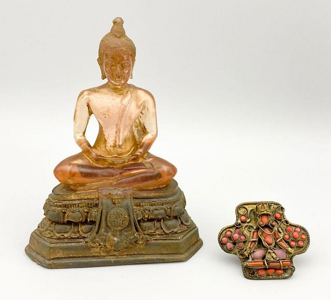 Translucent Composite Buddha Statue with older East: Translucent Composite Buddha Statue with older East Indian Ruby and Coral Buddha Talisman. Statue 5.25 in. x 4 in. x 2.25 in. Talisman 1.875 in. x 2 in. Measurements are approximate.
