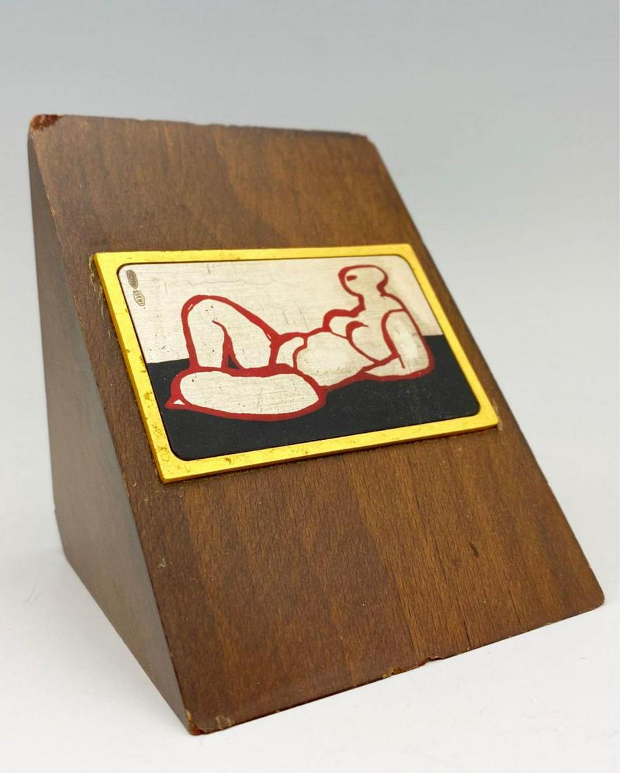 Salvatore Fiume, Reclining Nude, Etched and Polychromed: Beautiful incised .999 silver plaque of a modernist depiction of a nude woman, painted in pink and black, set in a brass frame, set in a wooden wedge display. Label on the back signed by artist, plate
