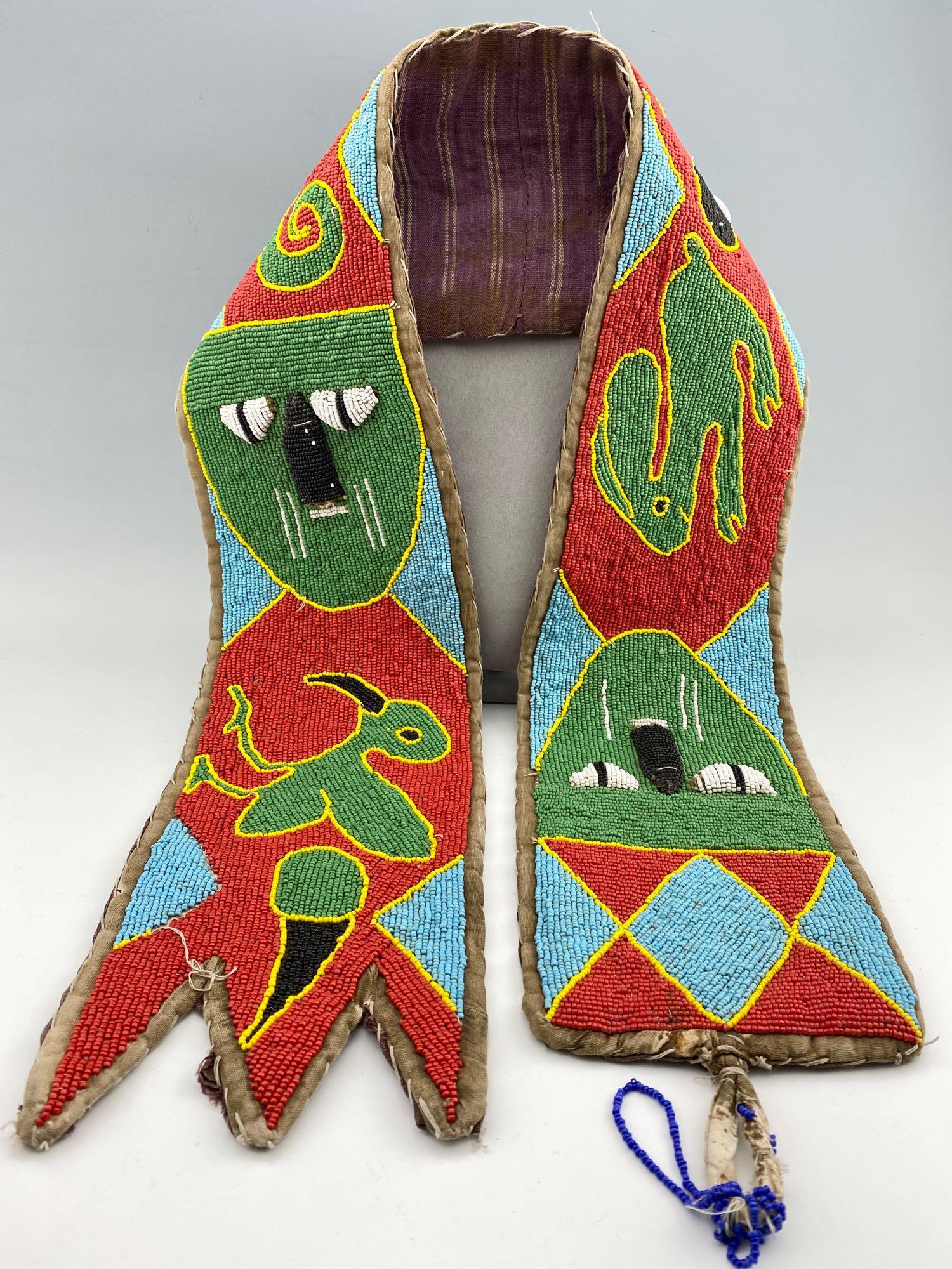 Ceremonial Beaded Sash Of The Yoruba Tradition Of Berin: Ceremonial Beaded Sash Of The Yoruba Tradition of Berin Nigeria. Featuring Bird, man, rabbit and lizzard. Approximately 46 in x 5.5 in.